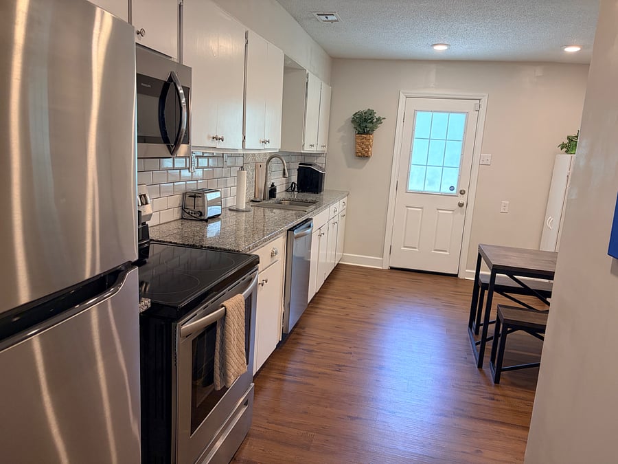 Fully stocked kitchen with mostly Pampered Chef products, pantry, Keurig, toaster, ice machine, and water filter