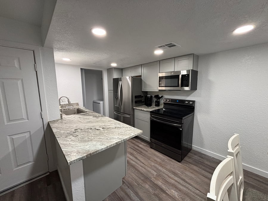 Fully stocked galley kitchen with brand new appliances.