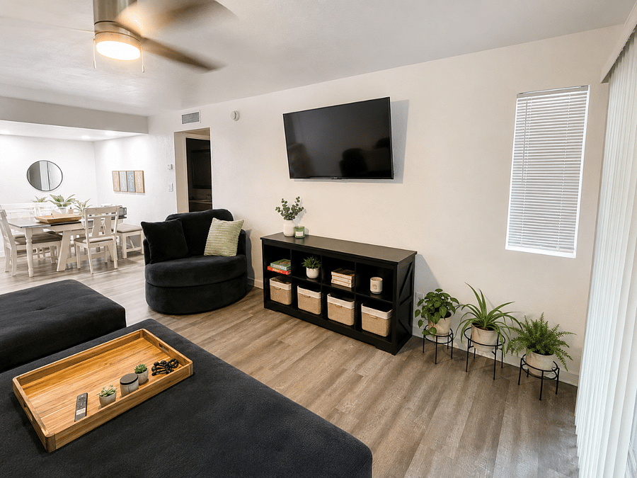 A warm, open gathering space where the dining table, comfortable seating, and smart TV come together for movie nights, and easy evenings at home.