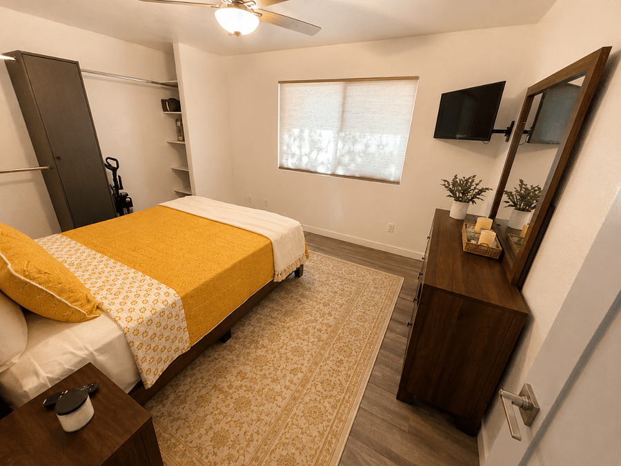 A calm, comfortable second bedroom with queen bed, generous storage, and smart TV, giving an easy place to unpack, settle in, and unwind.