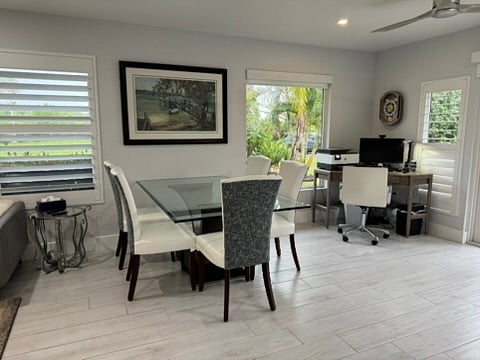 Dining table, pulled from wall will accommodate six.