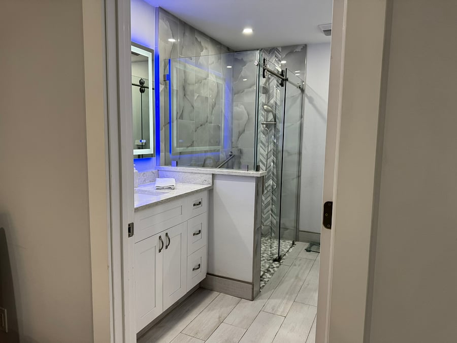 Shower in master bath has grab bars and no threshold for shower chair access. Personal care toilet with built in bidet.