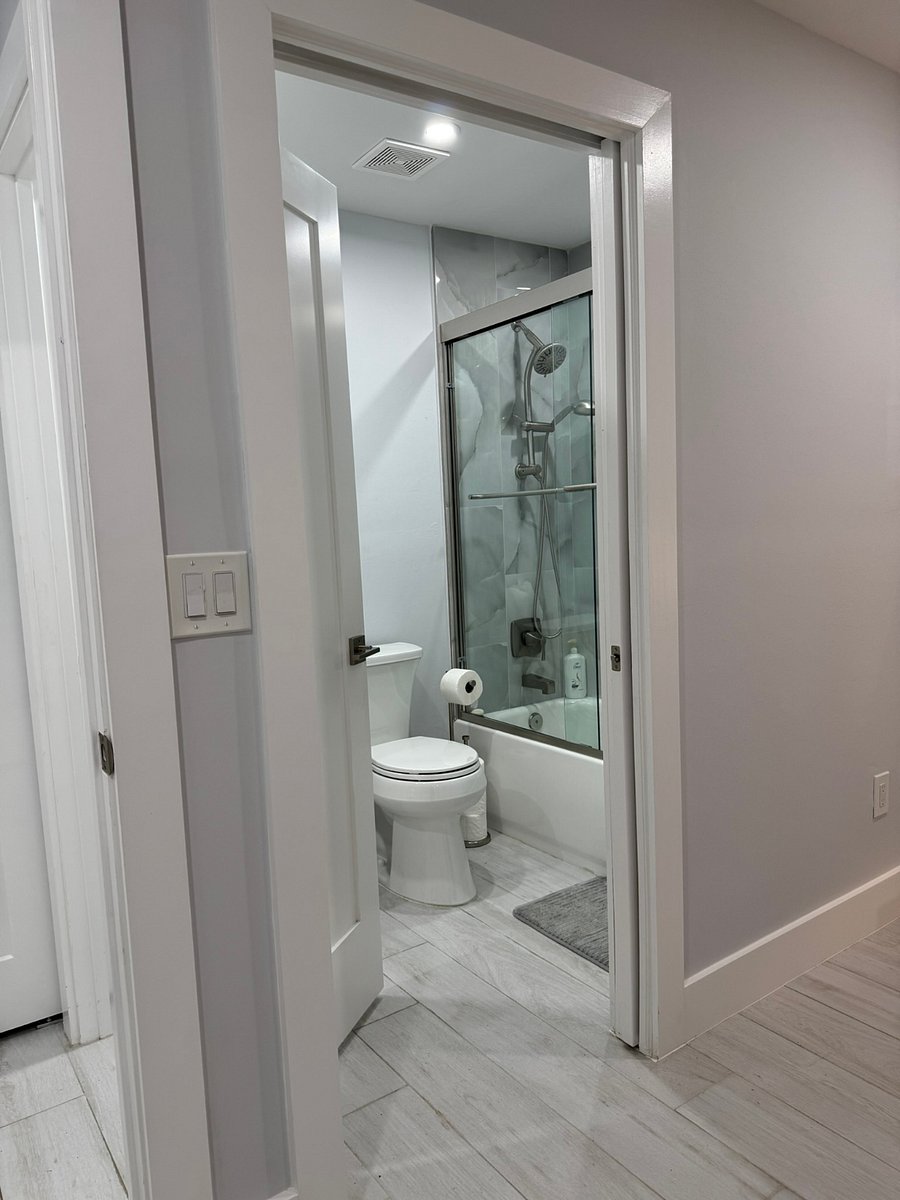 Shower tub combination. Quartz counter top.