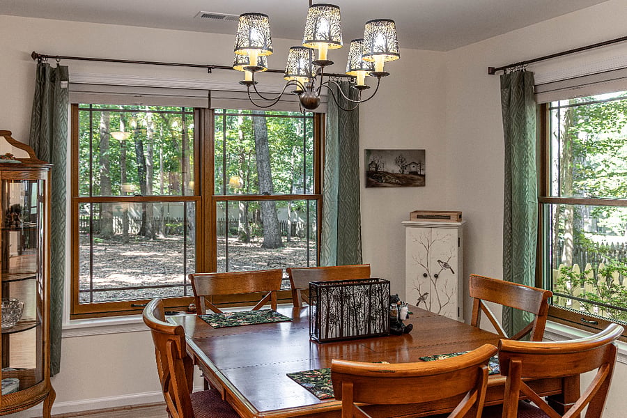 Dining table overlooking deck and large back yard