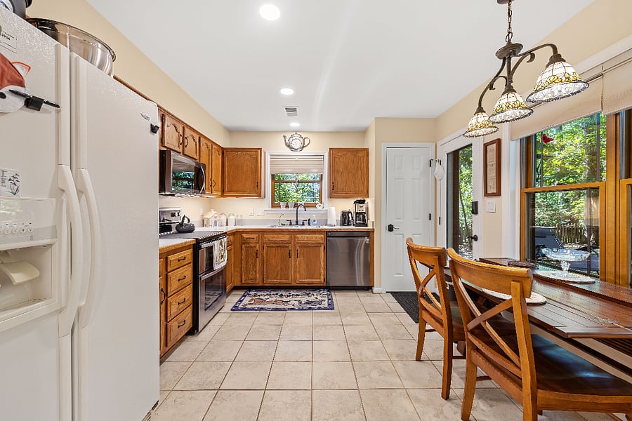 Spacious Kitchen with double oven and microwave, dishwasher and a pantry.