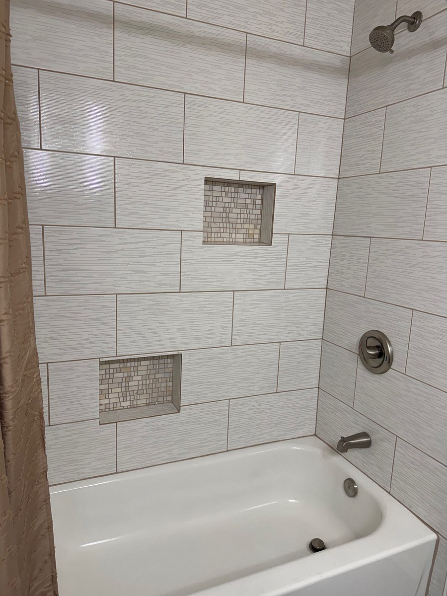 New renovated full bathroom, new tub, toilet, tile, and vanity.