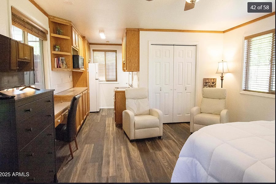 Dresser, and TV stand along with a desk area. There are two TV trays in the closet for eating area also.