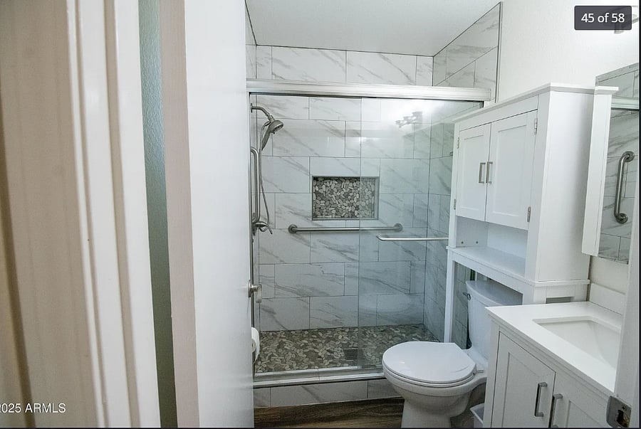 Full size bathroom, shower, toilet and vanity.