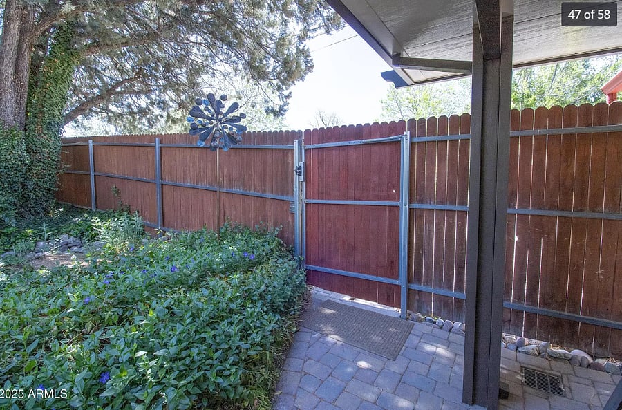 Entry gate and exit gate view from front porch which is covered 