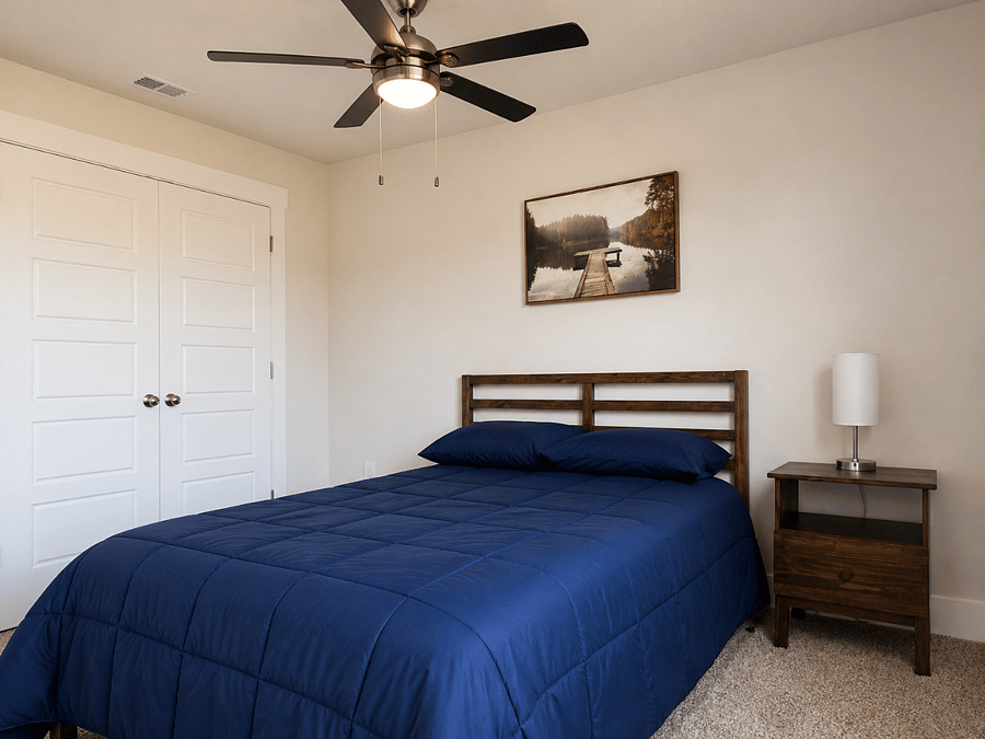 Comfortable full-size bed with Smart TV, closet & ceiling fan