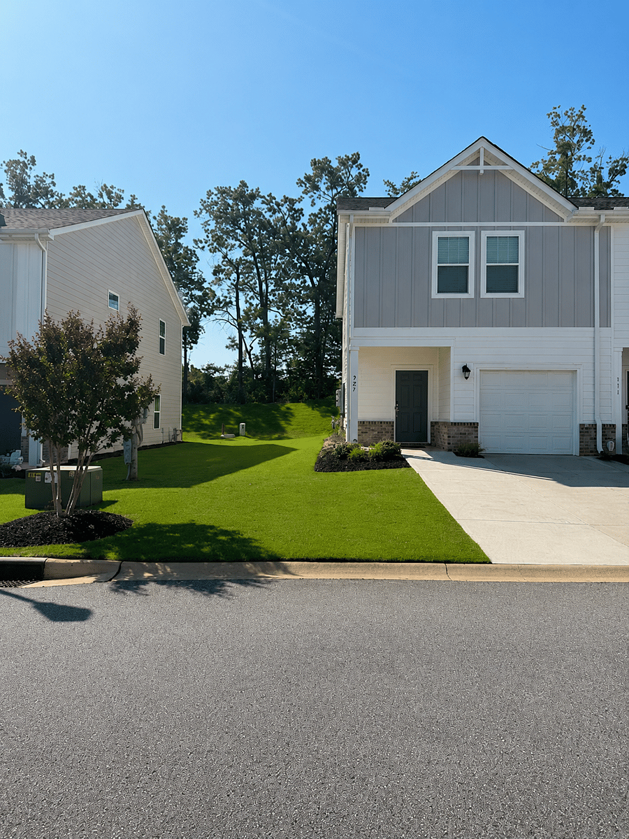2022-built end-unit townhome with private attached garage & driveway