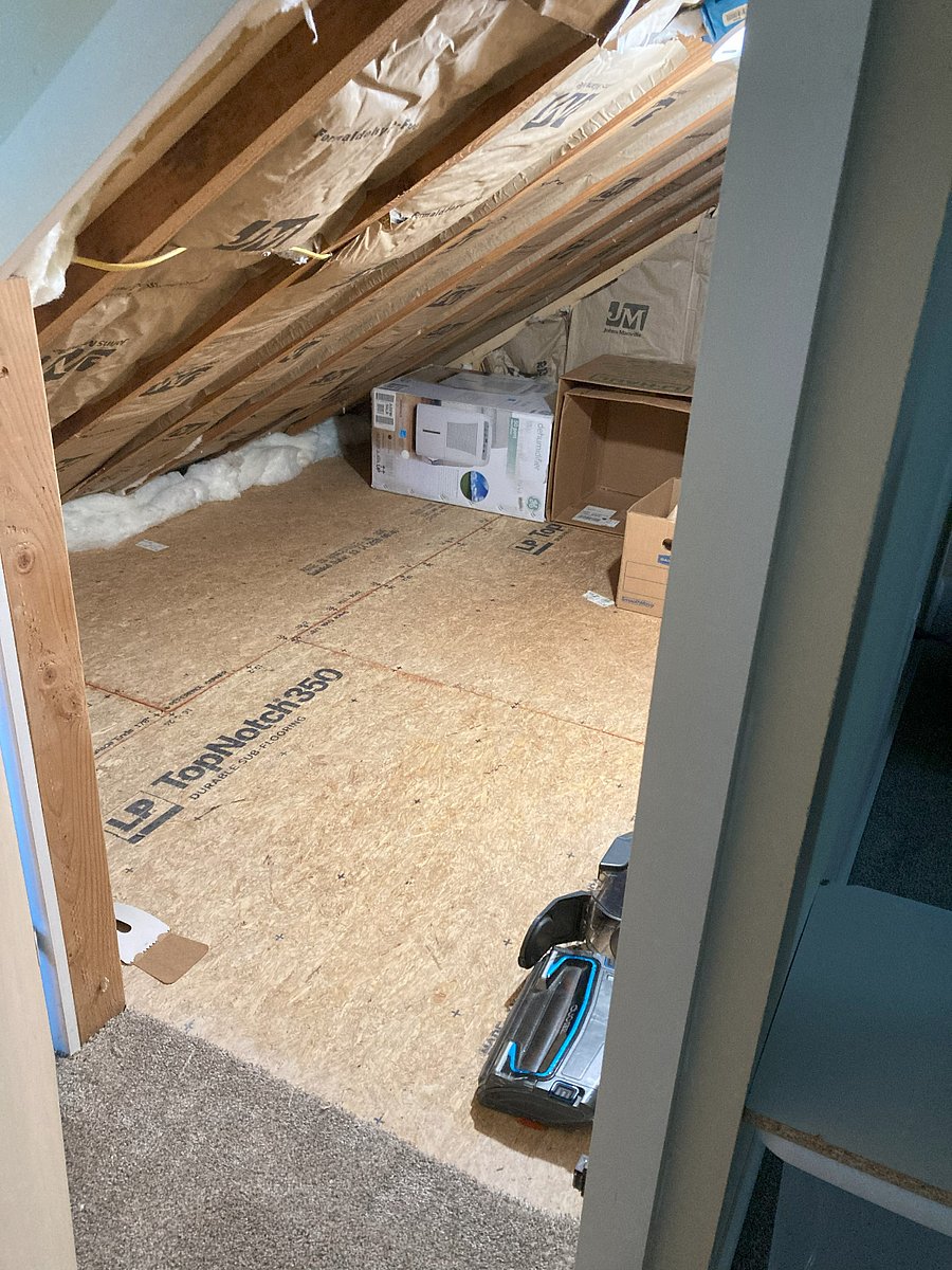 1 of 2 storage areas behind the knee wall.