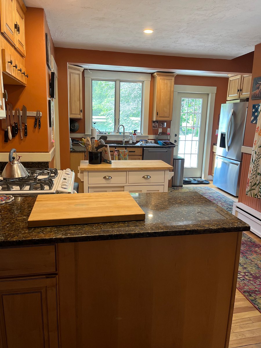 Bright kitchen with Granite Counters, door to deck