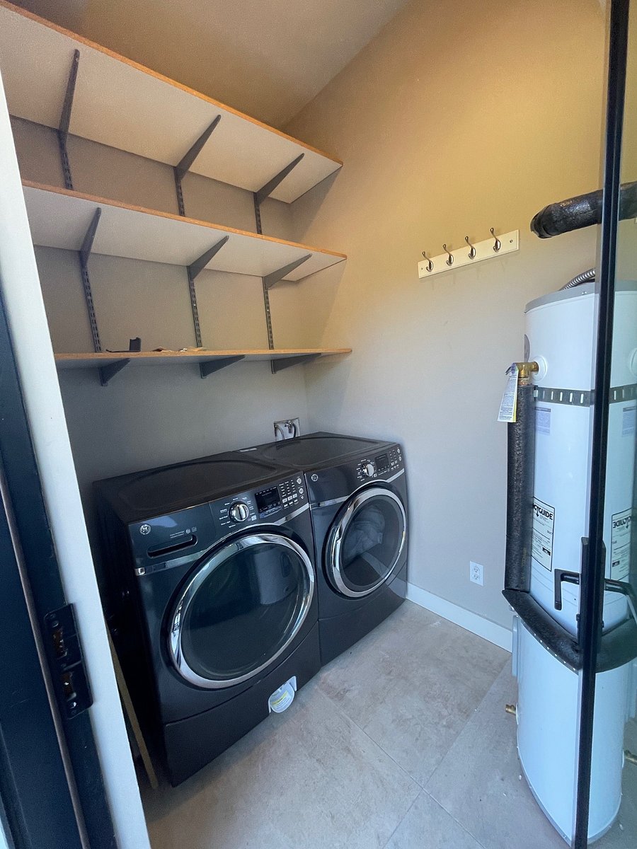 Full size washer and dryer for use solely by apartment tenant.