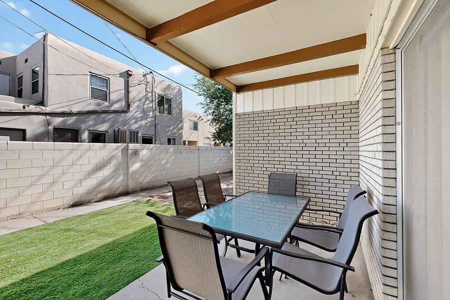 Backyard with patio, patio furniture, grill
