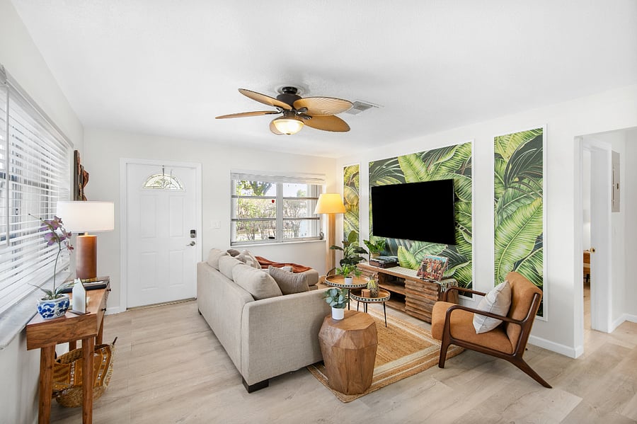 Watch TV, listen to a record, or turn in for the evening in this cozy living space. You'll find books, board games, and puzzles in the TV unit as well as remotes for the fan and patio string lights on the nesting coffee tables.