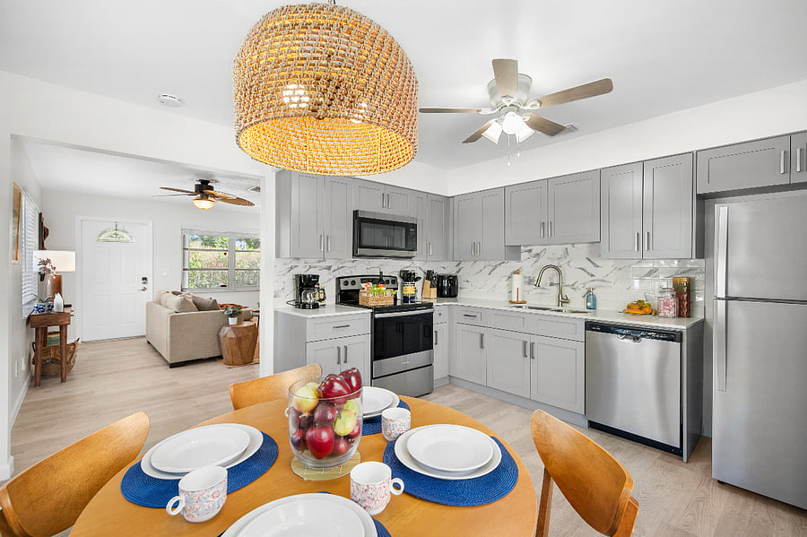Enjoy your meals at our 4-person dining table. In case you need extra seating during your stay, we provide fold-up chairs and a folding tray table in the queen bedroom closet.