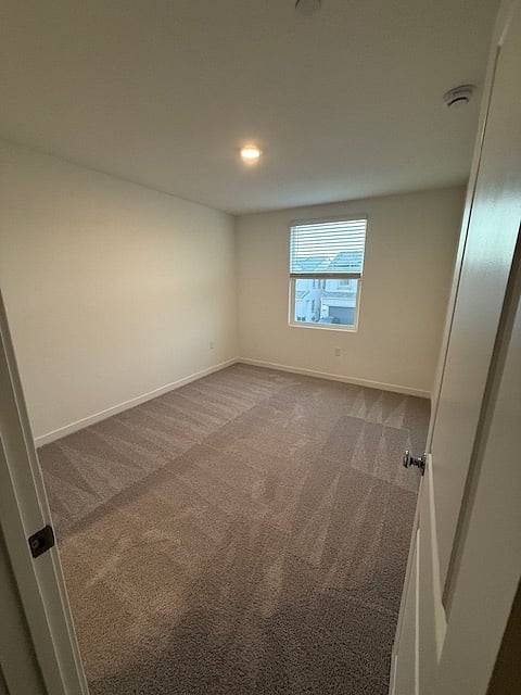 Primary bedroom - This room will be fully furnished with a bed, dresser, and nightstand prior to move-in. Features a spacious walk-in closet