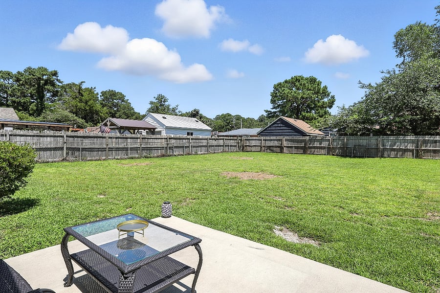 Escape to a spacious, fully-fenced backyard for field games, sunbathing, or a classic barbecue.