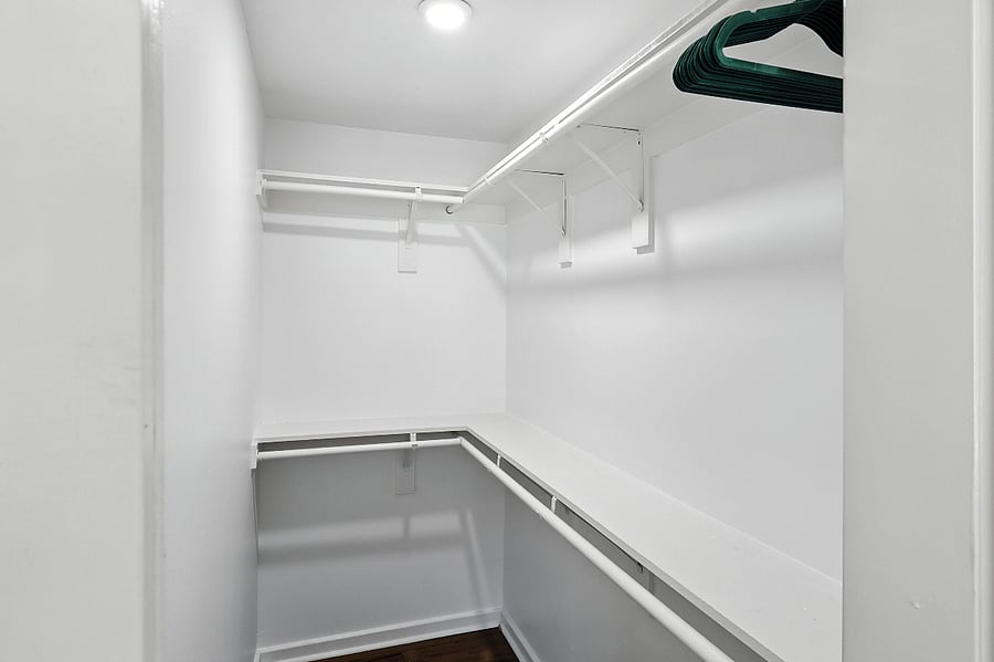 The primary bedroom walk-in closet offers an easy way to stay organized during your stay.