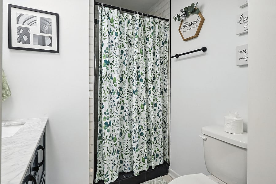 A steaming hot shower in the primary bedroom en-suite bath to wash away the day's stress.