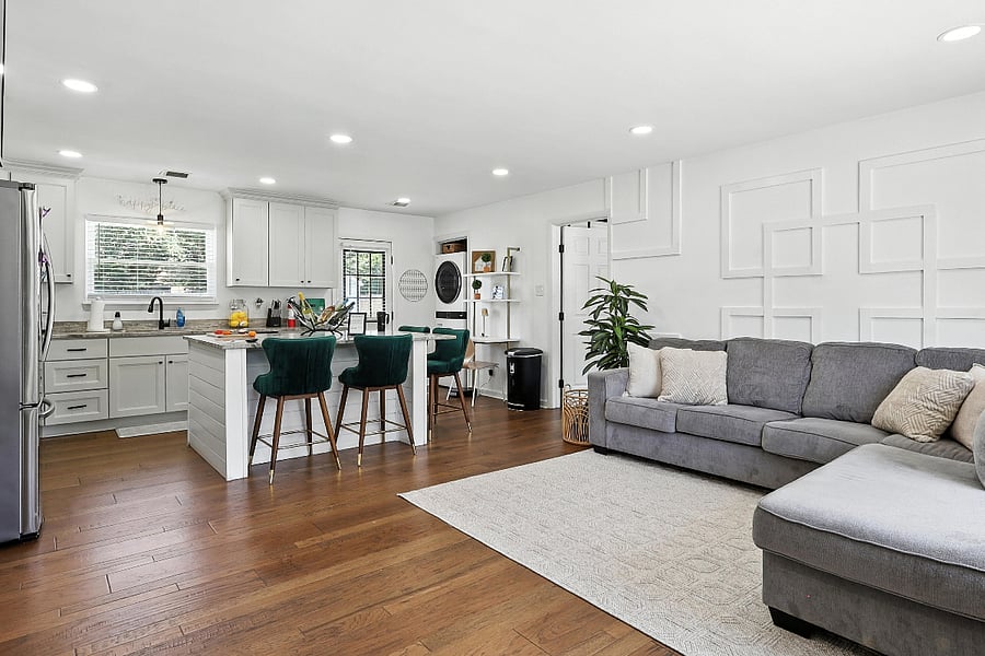 Relax in the stylish living room with a beautiful accent wall.