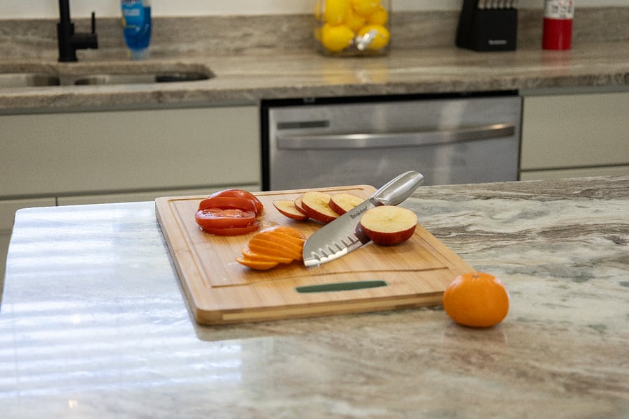 Prep like a pro: Quality cutting board and knives are supplied.
