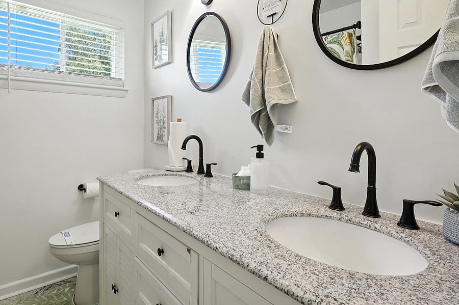 The shared bathroom offers a double vanity, ensuring everyone has plenty of space.