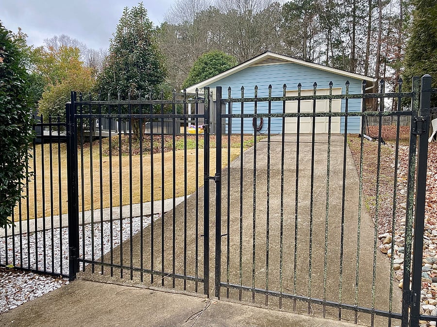 Private entrance and parking space with gate