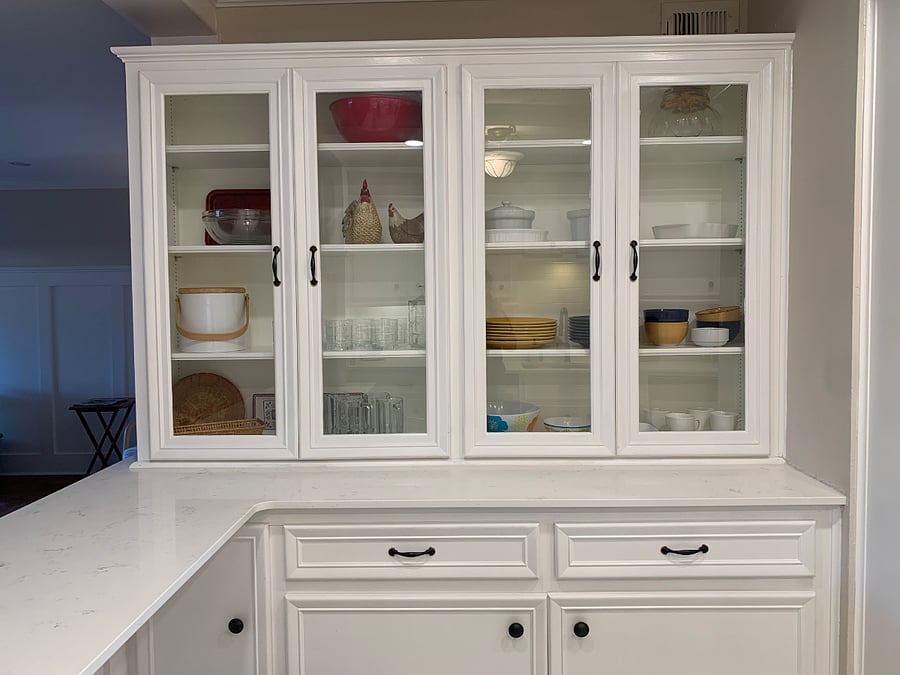 Kitchen cabinetry stocked with kitchenware. Tons of pantry space.