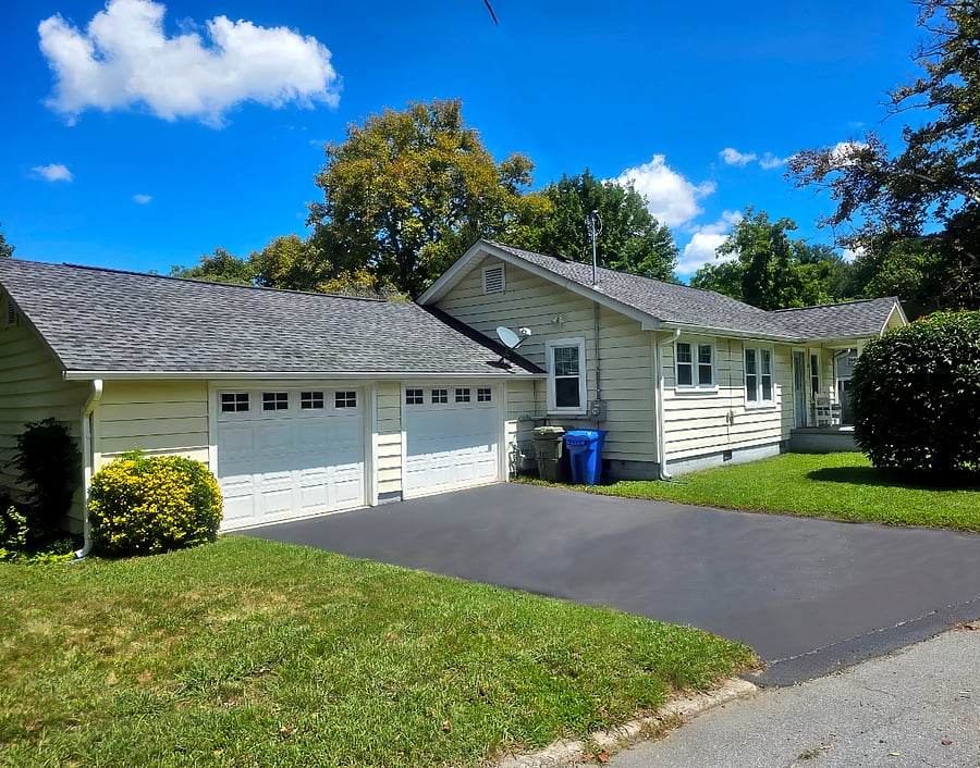 View of the front from the adjacent wooded lot