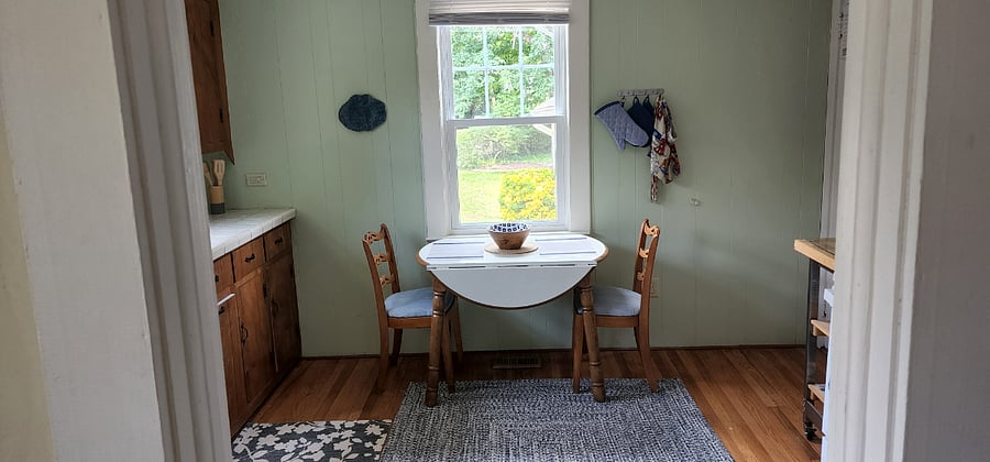 Small kitchen table overlooking the wooded lot