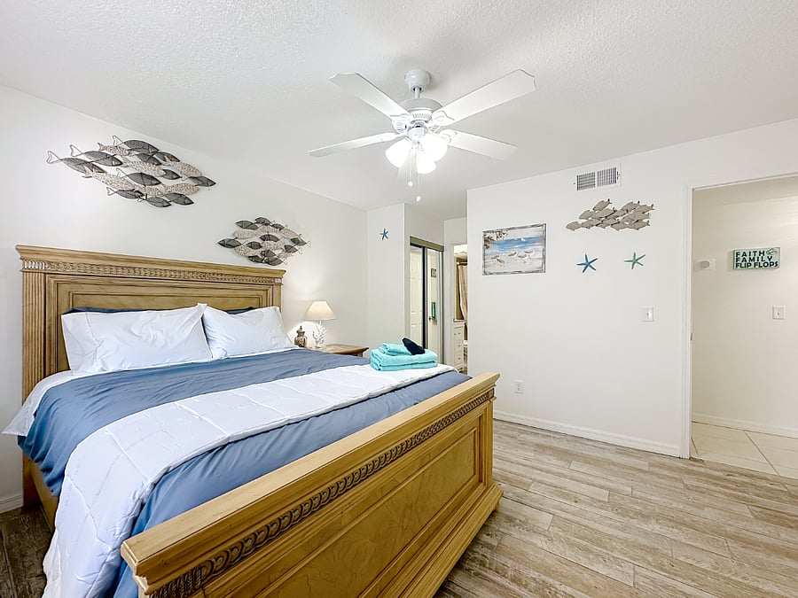 Master bedroom with queen size bed and private bathroom