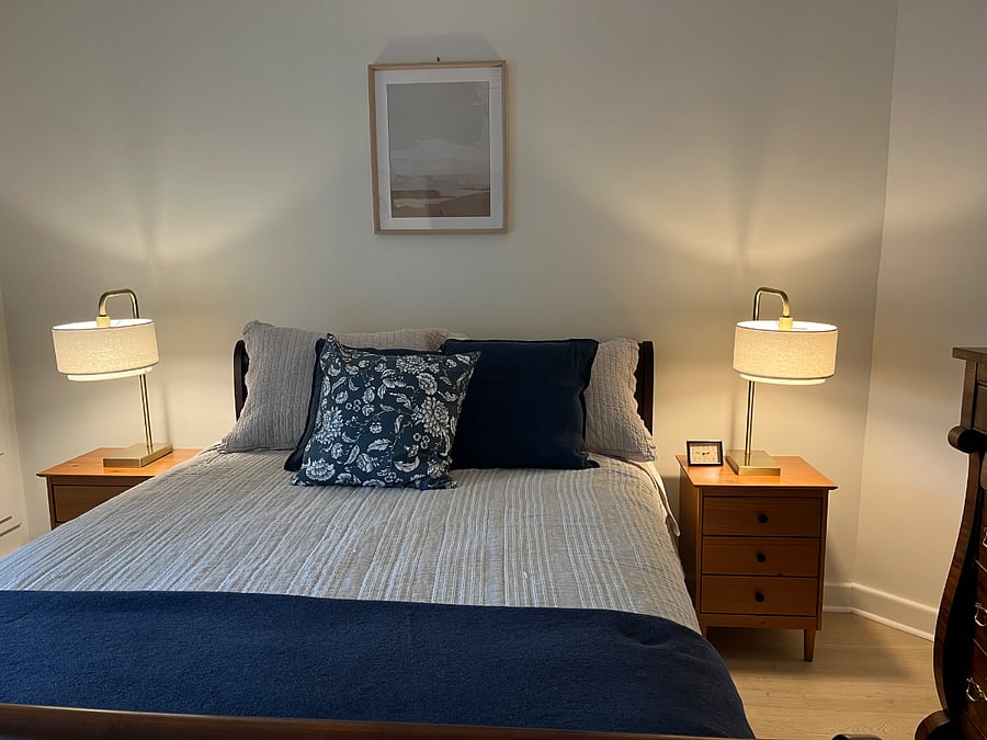 Master bedroom has new queen mattress and box spring, new bed stands and lights plus large bureau and built in storage wall. New luxury wood vinyl floors. 