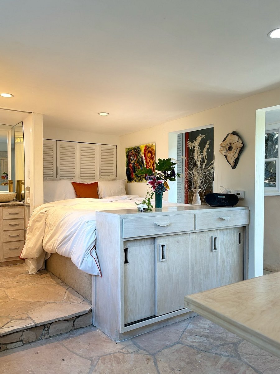 Downstairs unit - Platform bed with TV behind storage unit in front