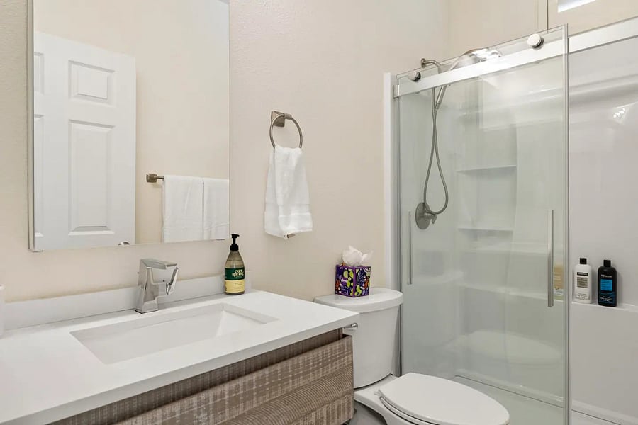 Second bathroom adjacent to second bedroom and near the main hallway