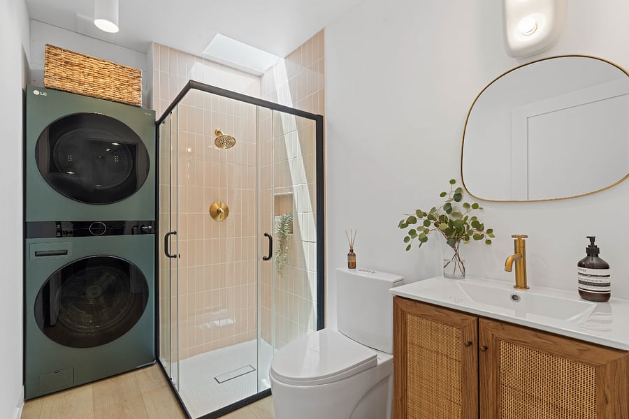 Bathroom with LG WashTower & skylight in shower