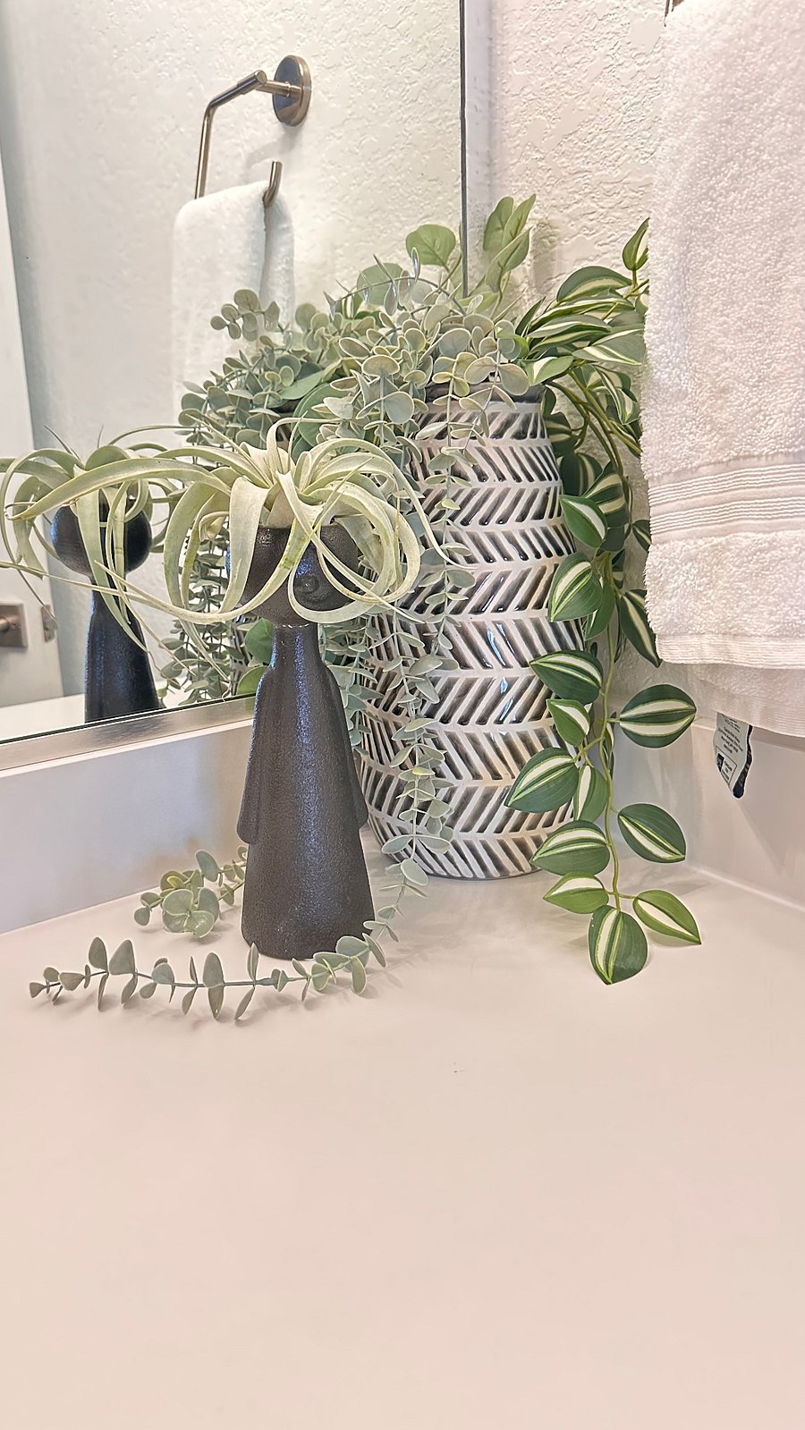 Simple, modern decor brightens even restrooms for a cozy, comfortable aesthetic.