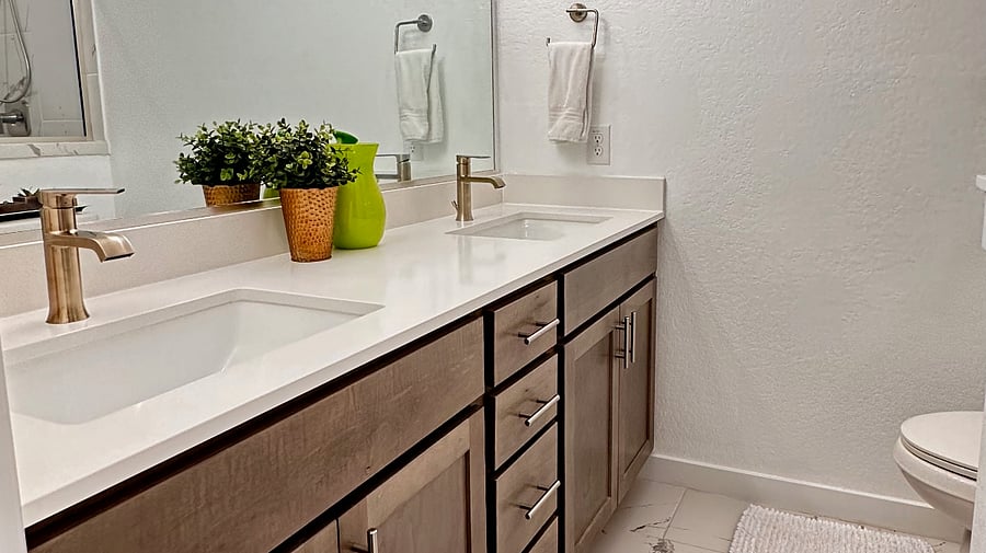 Primary King suite bathroom features 2 sinks and a shower.  100% cotton, bright white towels are provided, and older, thinner towels are provided for spills and messes.  No worries about stains on the older towels.