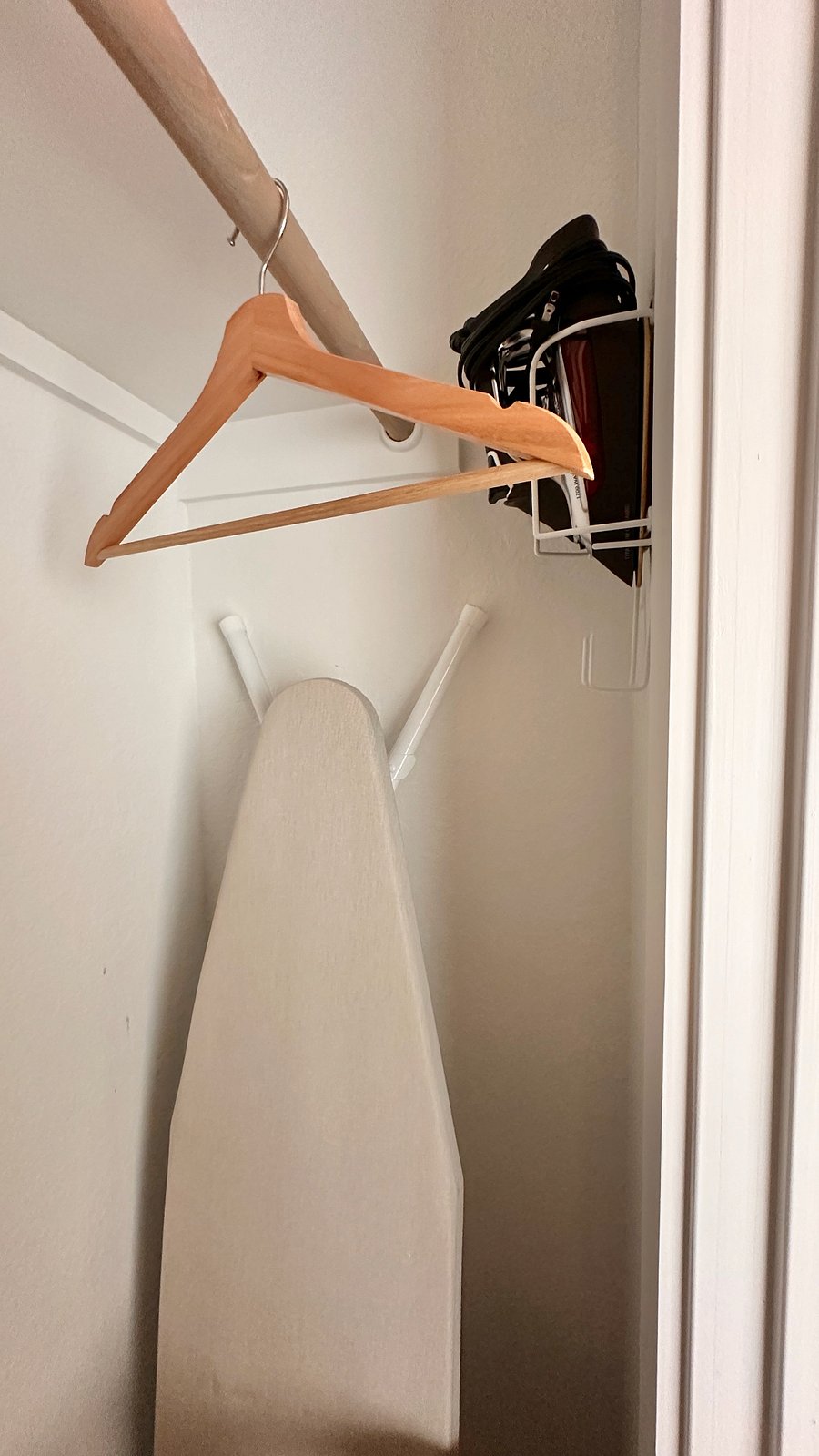Full sized iron and ironing board are stored in the closet of the first floor.