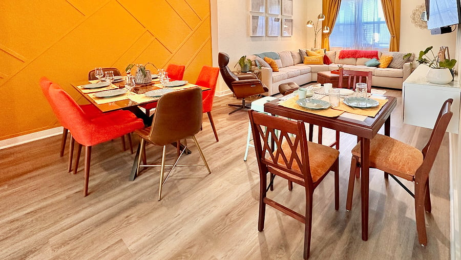 Seating for up to 10 is possible with a folding table and chairs that stow away behind the couch.