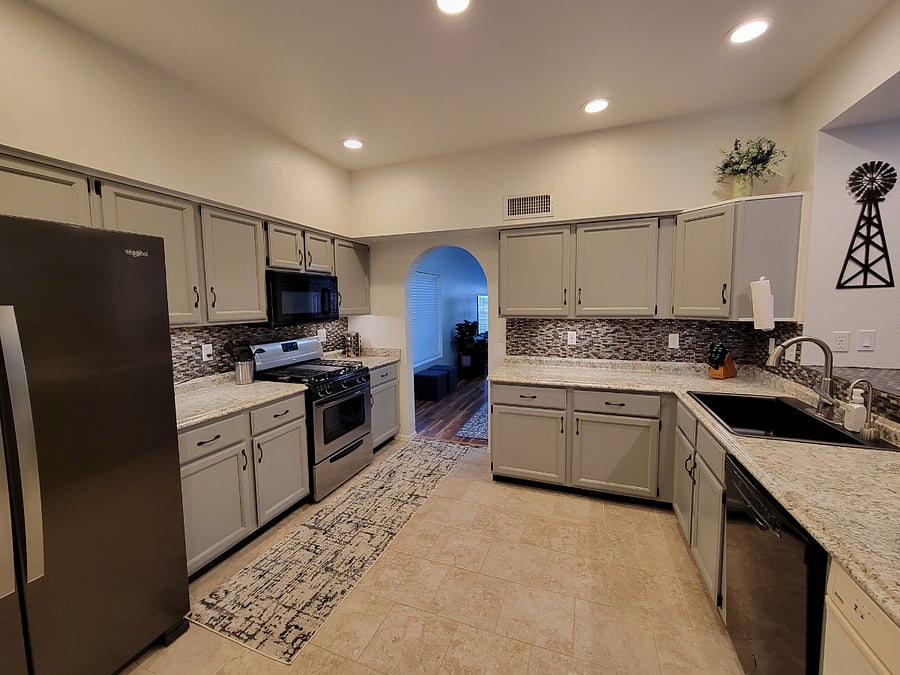 Large kitchen with tons of storage. Gas stove with a full set of pots and pans. Full size fridge with ice and water. 