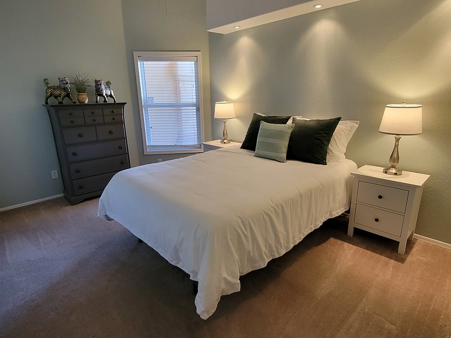 Queen size bed with closet, dresser, and two nightstands. 