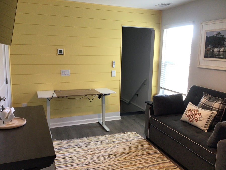 Work table for those days you don't commute. Love seat converts to full size bed.