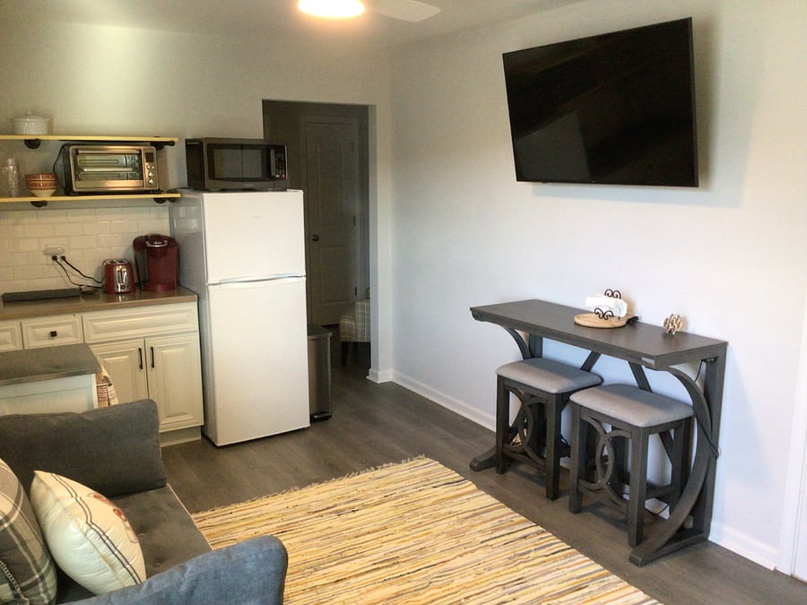 Fully applianced mini kitchen and table that seats 2
