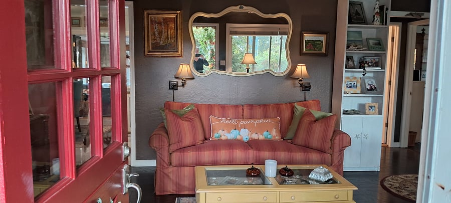 Looking into the living room, from outside the Dutch door, on the front porch