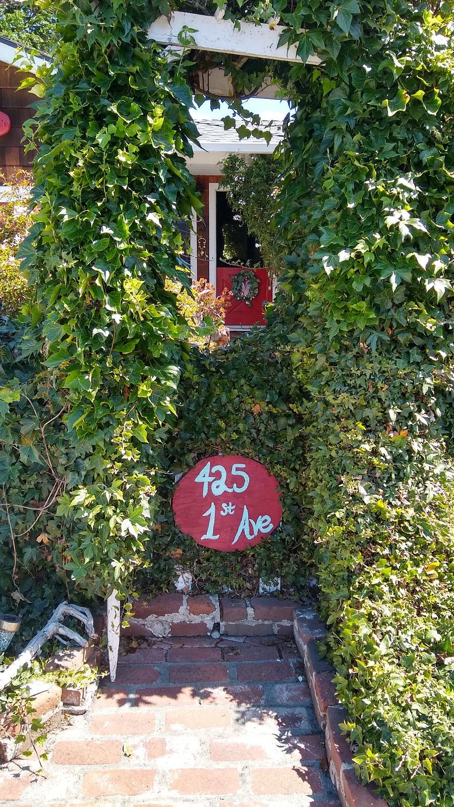Peeking through the ivy-covered arbor, into the front courtyard