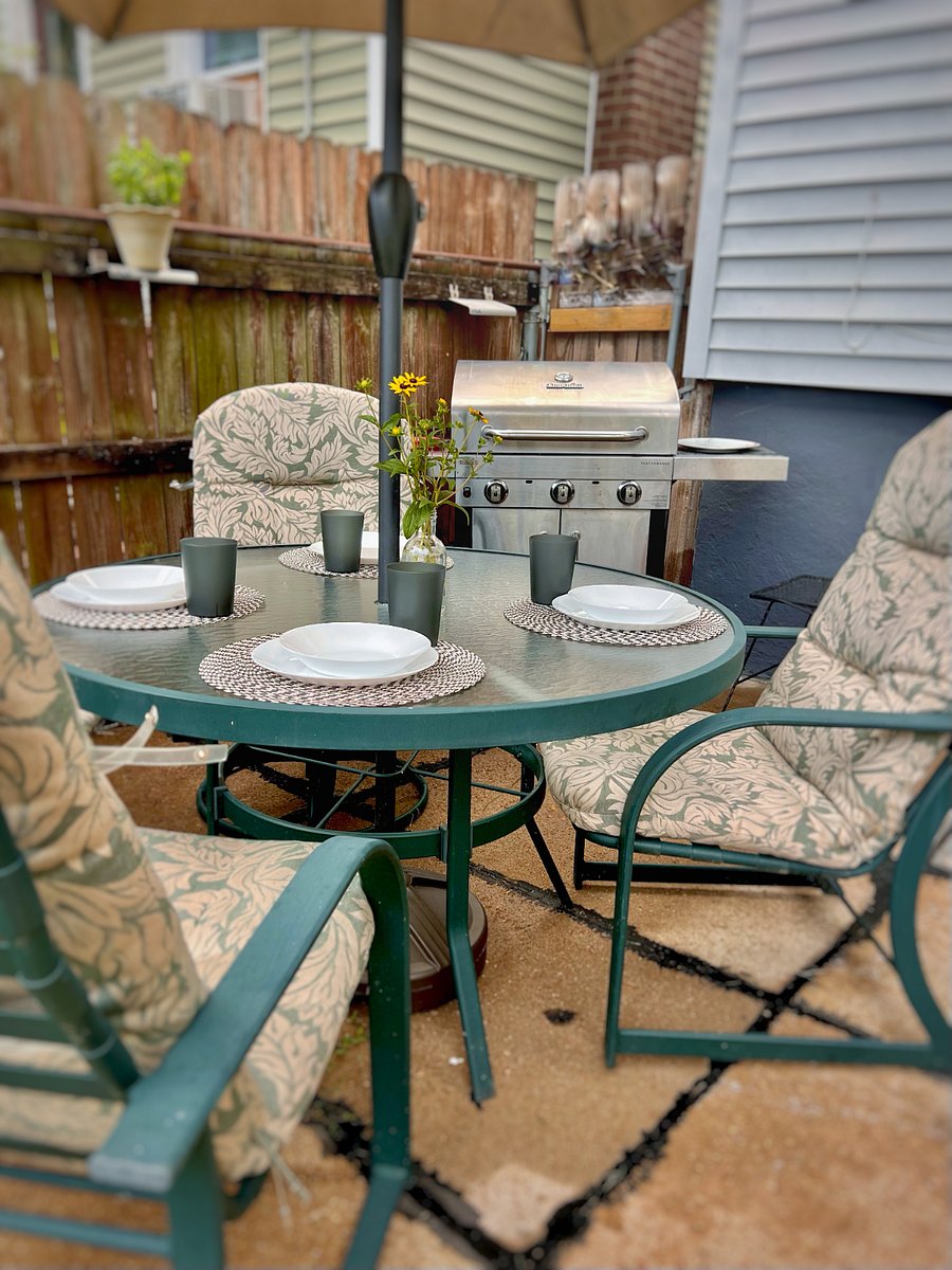 Enjoy the beautiful backyard with shared outdoor dining amenities.