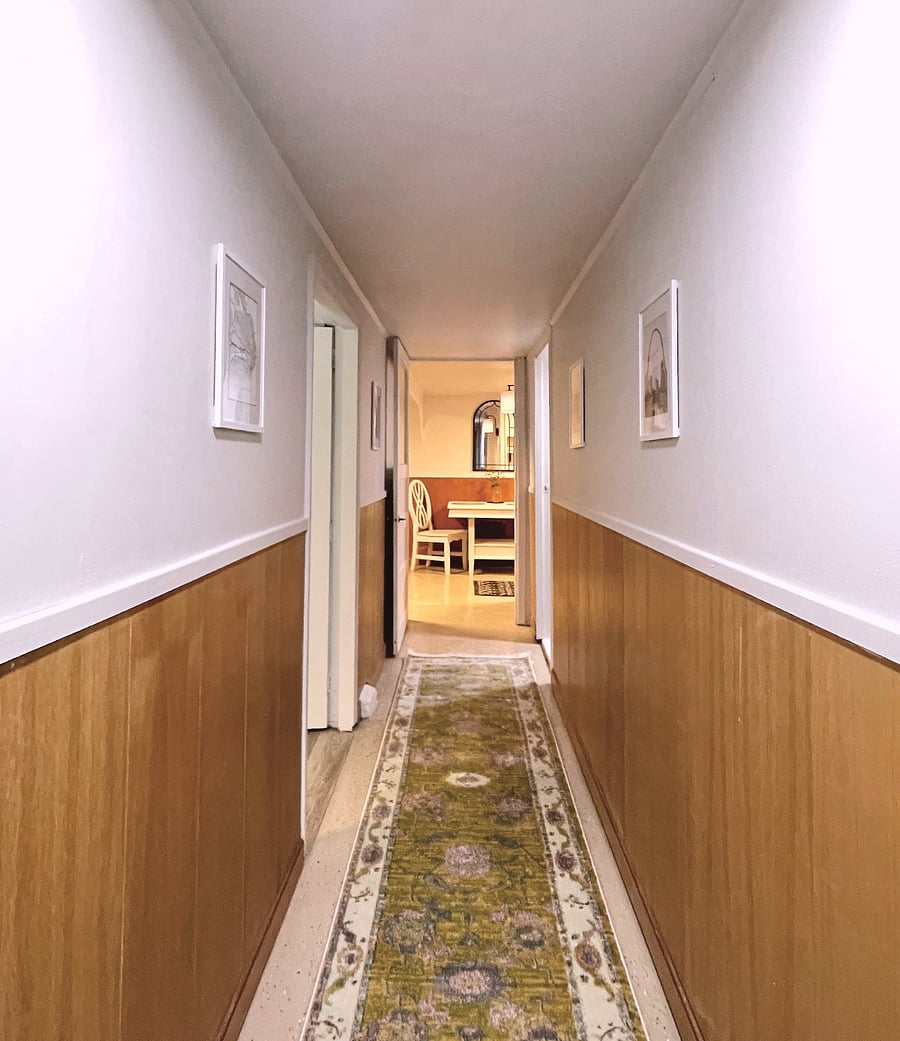 Entry hallway with coat hanger, utility room with shared washer & dryer.