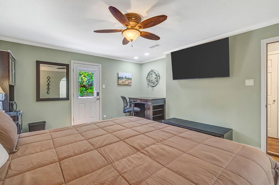 Primary Bedroom  California King Bed, TV, Desk, Kitchenet with private entrance.